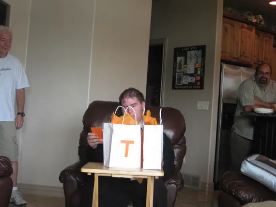 Alex opening up his gift