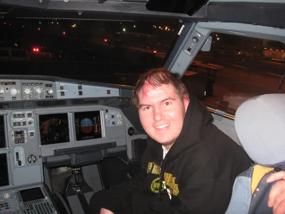 Alex in the cockpit of the plane