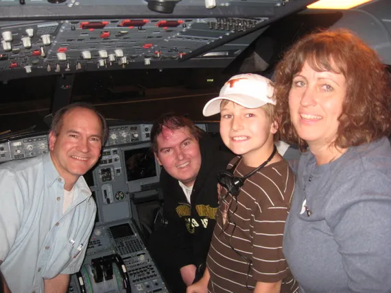 Alex, dad, Josh, and mom in the cockpit of the plane