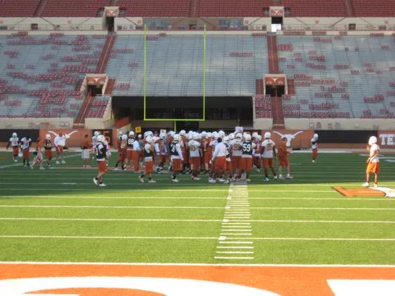 Texas football team practicing on the field