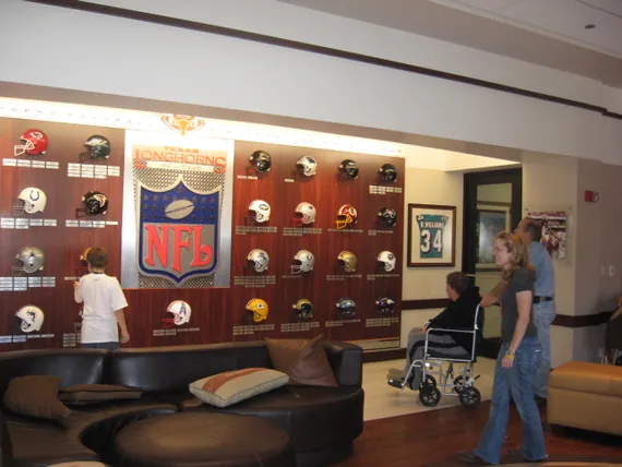 Alex, Josh, and Dad at NFL wall in Longhorns facility