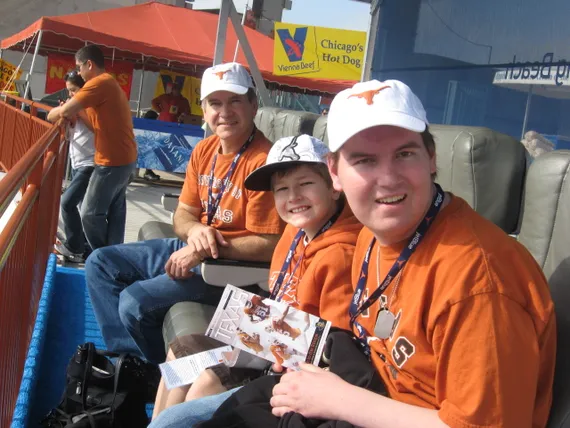 Alex, Josh, and Dad in the stands at the stadium