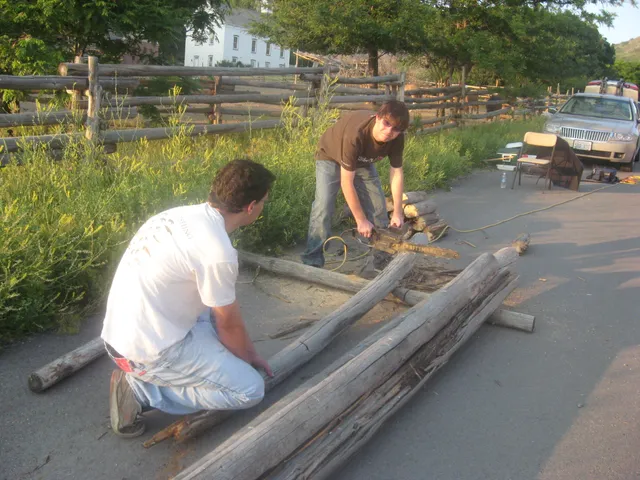 Connor and Alex cutting wood for Alex's eagle project